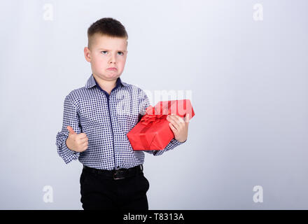 Birthday boy. Buy gifts. Child little boy hold gift box. Christmas or birthday gift. Holiday shopping seasonal sale. Wellbeing and positive emotions. Celebrate new year valentines day. Birthday gift. Stock Photo