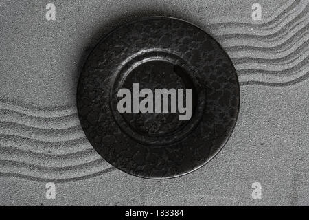 Empty black soup plate on dark grey background, top view Stock Photo