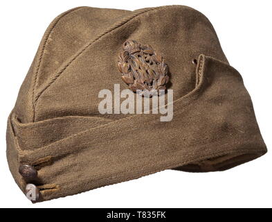 A field cap for NCOs/enlisted men of the Royal Flying Corps Officer's quality garrison cap of green-brown woollen cloth, the beige silk lining with maker 'Adamson & Co, Oxford', sweatband of green velvet. Sewn in on the left is the 'R.F.C.' badge in bronze issue for enlisted men, at the front two 12.5 mm buttons. Slight signs of usage and age. historic, historical, troop, troops, armed forces, military, militaria, army, wing, group, air force, air forces, 20th century, Editorial-Use-Only Stock Photo