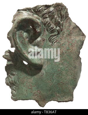 A Roman head fragment of a bronze statue 1st/2nd century AD. Bronze with green patina. Life-size relief fragment of a statue, probably representing an emperor, with right ear and parts of a finely crafted hairline. Break lines on all sides, the reverse more strongly sintered. Height 14.5 cm. Provenance: South German private collection, 1970s and later. historic, historical, Roman Empire, ancient world, ancient times, ancient world, Additional-Rights-Clearance-Info-Not-Available Stock Photo