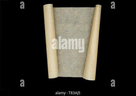 Craft beige scroll paper with twisted two sides with copy space and isolated on black background Stock Photo