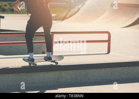 skateboarding - skater boy doing trick at skatepark Stock Photo
