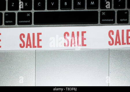 SALE sign on top of laptap keyboard Stock Photo