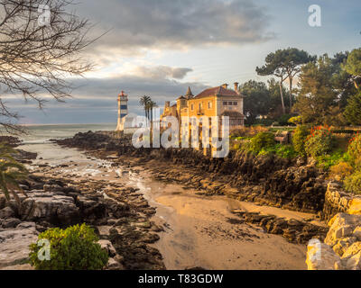 Sunrise view of Santa Marta lighthouse and Municipal museum of Cascais during ocean outflow,  in Portugal. Stock Photo