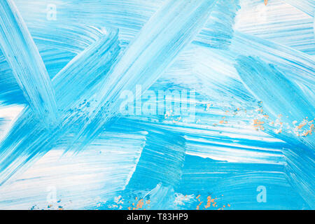 Blue and white abstract art painting on a brown cardboard. Creative abstract hand painted background. Dynamic brush strokes. Stock Photo