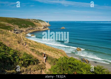 France, Finistere, Regional Natural Park of Armorica, Marine Natural Park of iroise, Plogoff, the Pointe du Raz ranked Grand National Site, hikers on the hiking trail 34 Stock Photo