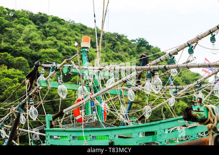 Spotlights was hanging on a fishing boat and squid fishing to catch the fish in the night Stock Photo