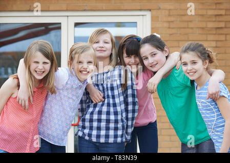 Portrait Of Female Elementary School Pupils Outside Classroom Stock Photo