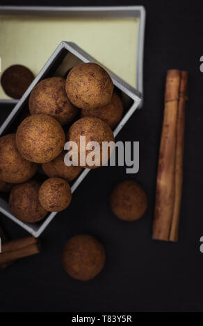 cinnamon chocolate balls. Temptation food. A delicious gift for bonbons lovers Stock Photo