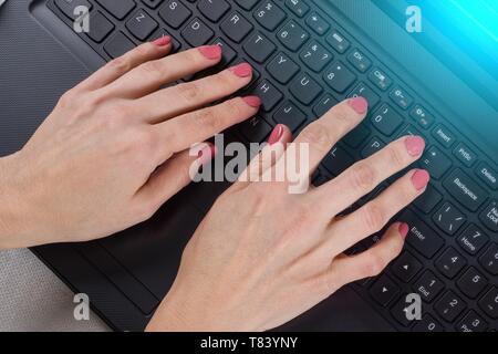 Female hands on the computer keyboard - business, education, programming, people and technology concept Stock Photo