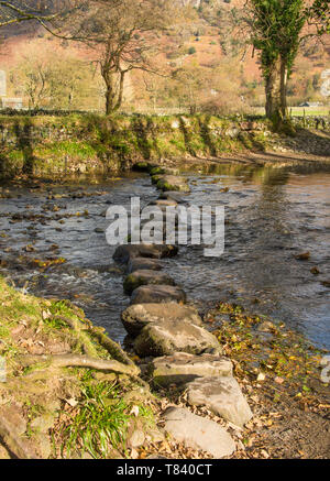The stepping stones cross a stream in the Lake District in Cumbria,UK a UNESCO World Heritage Site.