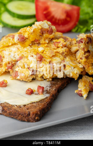 scrambled eggs on a rye bread Stock Photo