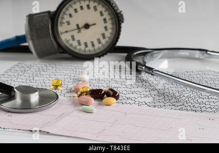 medical stethoscope with tonometer and ecg on a light background Stock Photo