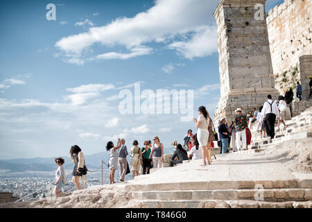 ATHENS, Greece - The Acropolis of Athens is an ancient citadel standing on a rocky outcrop above Athens, Greece. It is one of the most famous archeological sites in the world and is a UNESCO World Heritage site. It consists of a number of structures on the top of the hill, along with other sites on the surrounding hillside. The most famous structure if the Parthenon, a large temple dating back to the 5th century BC and featuring a distinctive outer layer of large columns. Stock Photo