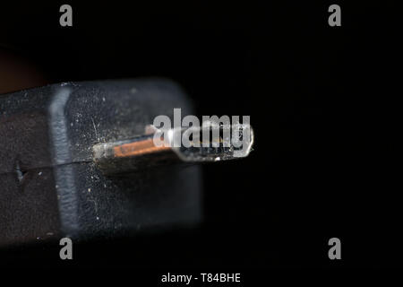 used micro usb close-up on black background Stock Photo