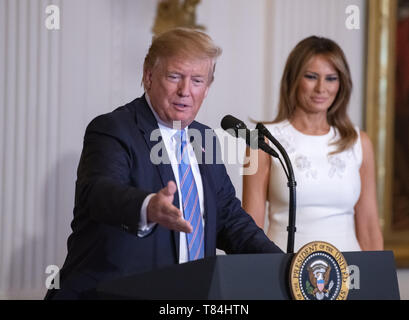 Washington, District of Columbia, USA. 10th May, 2019. President DONALD TRUMP and First lady MELANIA TRUMP participate in the Celebration of Military Mothers in the East Room of the White House in Washington. Credit: Ron Sachs/CNP/ZUMA Wire/Alamy Live News Stock Photo