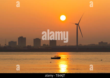 Liverpool, Merseyside. 11th May, 2019. UK Weather: Bright, Hazy start to the day as the sun rises over the River Mersey, docks and harbour. Credit: MediaWorldImages/Alamy Live News Stock Photo