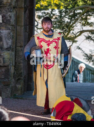 Medieval Day. Dirleton Castle, East Lothian, Scotland, United Kingdom, 11 May 2019. Historic Environment Scotland family fun day historical re-enactment of Medieval battles by people dressed in medieval costume from the Historic Saltire Society; Robert the Bruce seizes the castle from Aymer de Valence in early 1300s during a re-enactment of the seizing of the castle Stock Photo