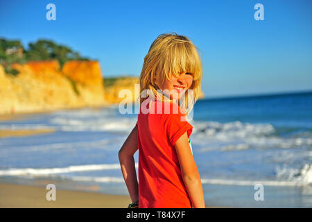 Portrait of a smiling boy on the beach, Portugal Stock Photo