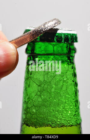 Detail of Man Opening Beer Bottle Stock Photo