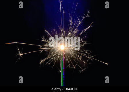 Burning sparkler isolated on black background Stock Photo