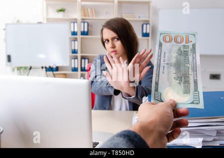 Beautiful female employee unhappy with excessive work Stock Photo
