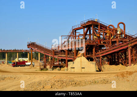 Mining quarry for the production of crushed stone, sand and gravel for use in construction. Crushing factory, machines and equipment for crushing, gri Stock Photo
