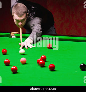 Snooker player taking a shot Stock Photo