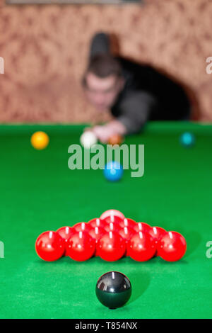 Snooker player taking a shot Stock Photo