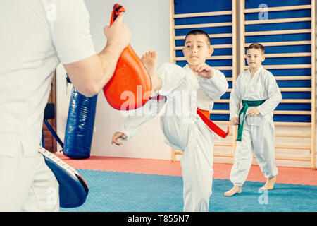 Children in taekwondo class Stock Photo