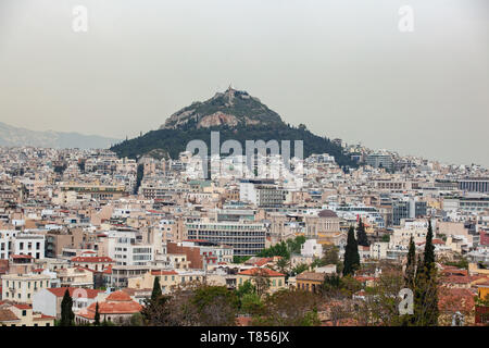 View from Acropolis on cityscape of Athens and Lycabettus Hill, known as Lykabettos. It is a Cretaceous limestone hill in Athens Greece Stock Photo