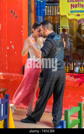 Tango dancers at a restaurant on El Caminito, a colourful street in La Boca district of Buenos Aires, Argentina Stock Photo