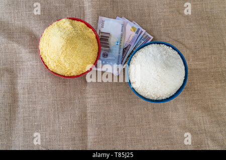 Nigerian yellow and white Garri in Bowls at marketplace - ready to sell Stock Photo