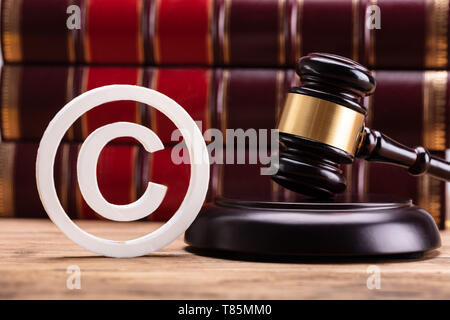 Wooden Christian Cross On Holy Bible Over Wooden Table Stock Photo