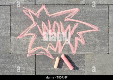 Wow written on gray sidewalk, top view. Stock Photo
