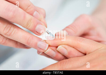 Woman having manicure Stock Photo