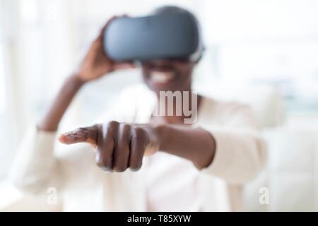 Woman wearing VR headset Stock Photo