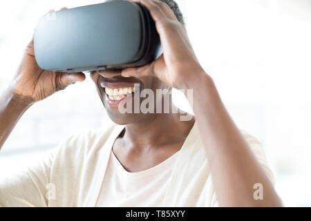 Woman wearing VR headset Stock Photo