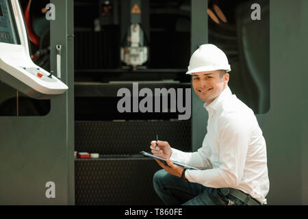 Engineer working in factory Stock Photo
