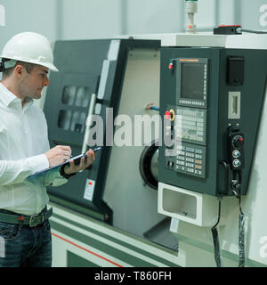 Engineer working in factory Stock Photo