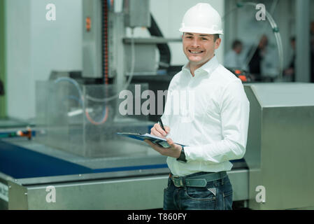 Engineer working in factory Stock Photo