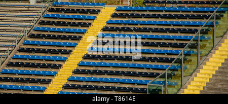 plastic seats on stadium tiers Stock Photo