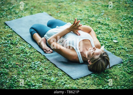 Woman doing yoga Stock Photo