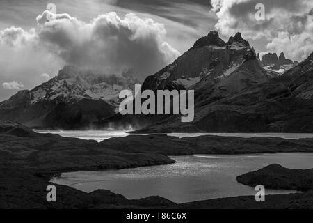 Black and white photograph of Nordenskjold and Pehoe Lake during a strong wind storm in Torres del Paine national park, Patagonia, Chile. Stock Photo