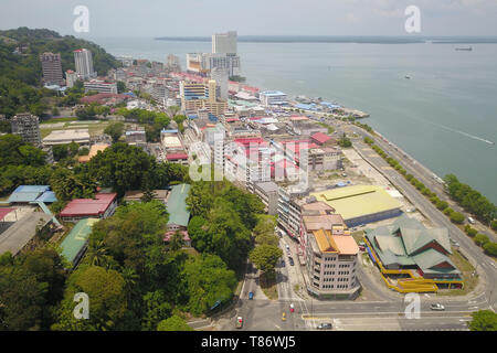 aerial view of small town near sea.Partial view of Sandakan town situated in Sabah east coast once known as Little Hong Kong of Borneo. Stock Photo