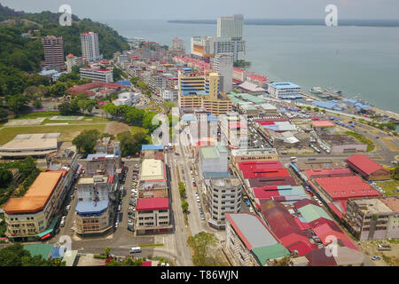 aerial view of small town near sea.Partial view of Sandakan town situated in Sabah east coast once known as Little Hong Kong of Borneo. Stock Photo