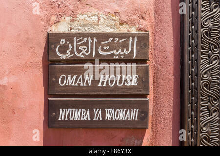A wooden sign at the entrance of Oman House, Fort Jesus, Mombasa, Kenya Stock Photo