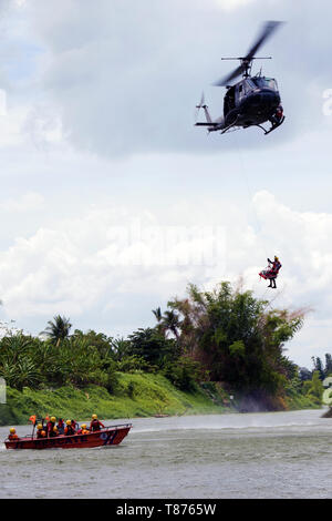 Dominican Republic Civil Defense, Air Force search and rescue squadron, Army and other governmental and non-governmental organizations participated in water-rescue simulations as part of Fuerzas Aliadas Humanitarias 2019 in a river near Bajo Yuna May 9, 2019. FA-HUM 19 is a U.S. Army South-sponsored foreign humanitarian assistance and disaster relief exercise designed to build U.S. partner nation’s capacity for civil and military response to major disasters. More than 100 national experts from over 13 Latin American countries will operate jointly throughout FA-HUM 19 simulations and training e Stock Photo