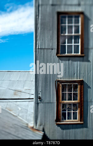 Windows in a Wall with Metal Siding Stock Photo
