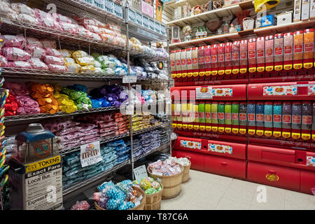 A corner of the iconic ECONOMY CANDY store on the lower east side with chocolates, jelly beans and a vintage token machine. New York City. Stock Photo